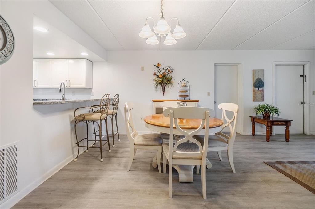 12760 Indian Rocks Road, Unit 104 Largo, FL 33774 - Photo 7 of 37 a dining room with furniture and window