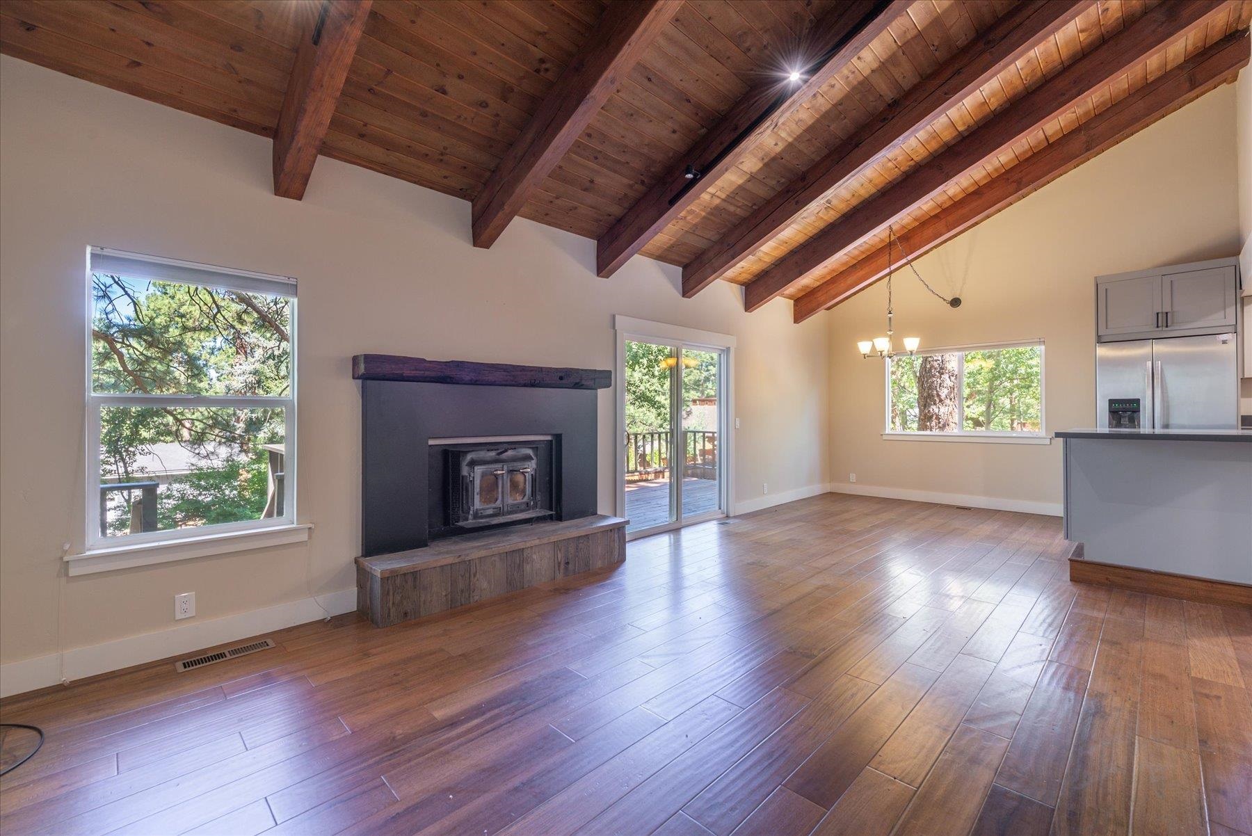 10644 Codogan Street Truckee, CA 96161 - Photo 12 of 28 a view of an empty room with wooden floor and a window