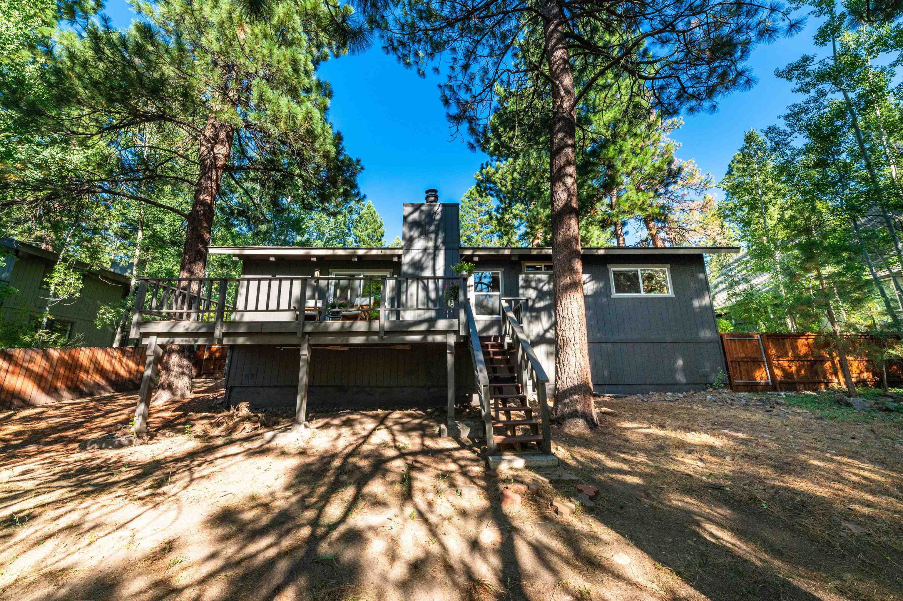 10644 Codogan Street Truckee, CA 96161 - Photo 22 of 28 a view of a house with backyard and sitting area