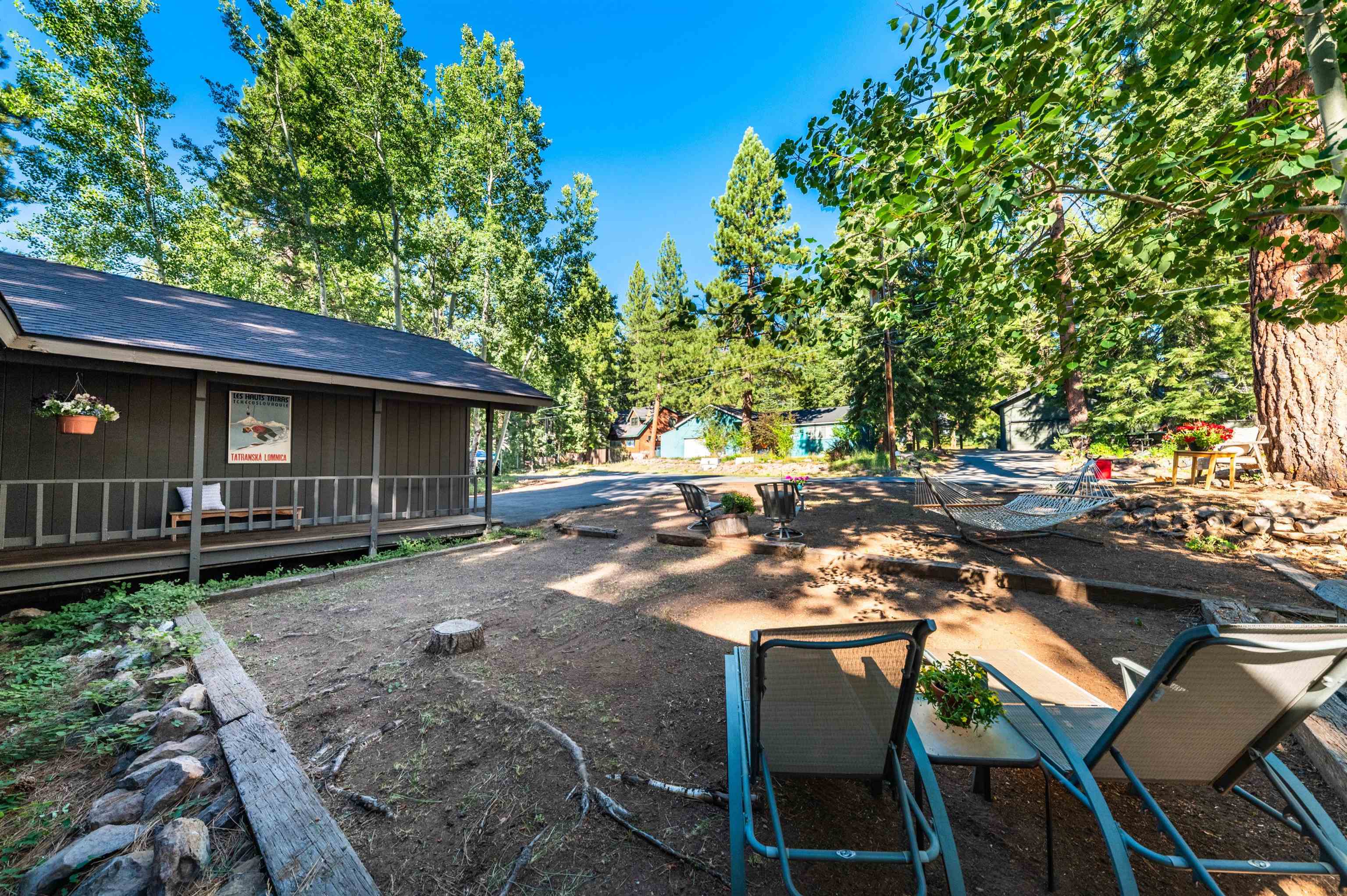 10644 Codogan Street Truckee, CA 96161 - Photo 28 of 28 a view of backyard with table and chairs and potted plants
