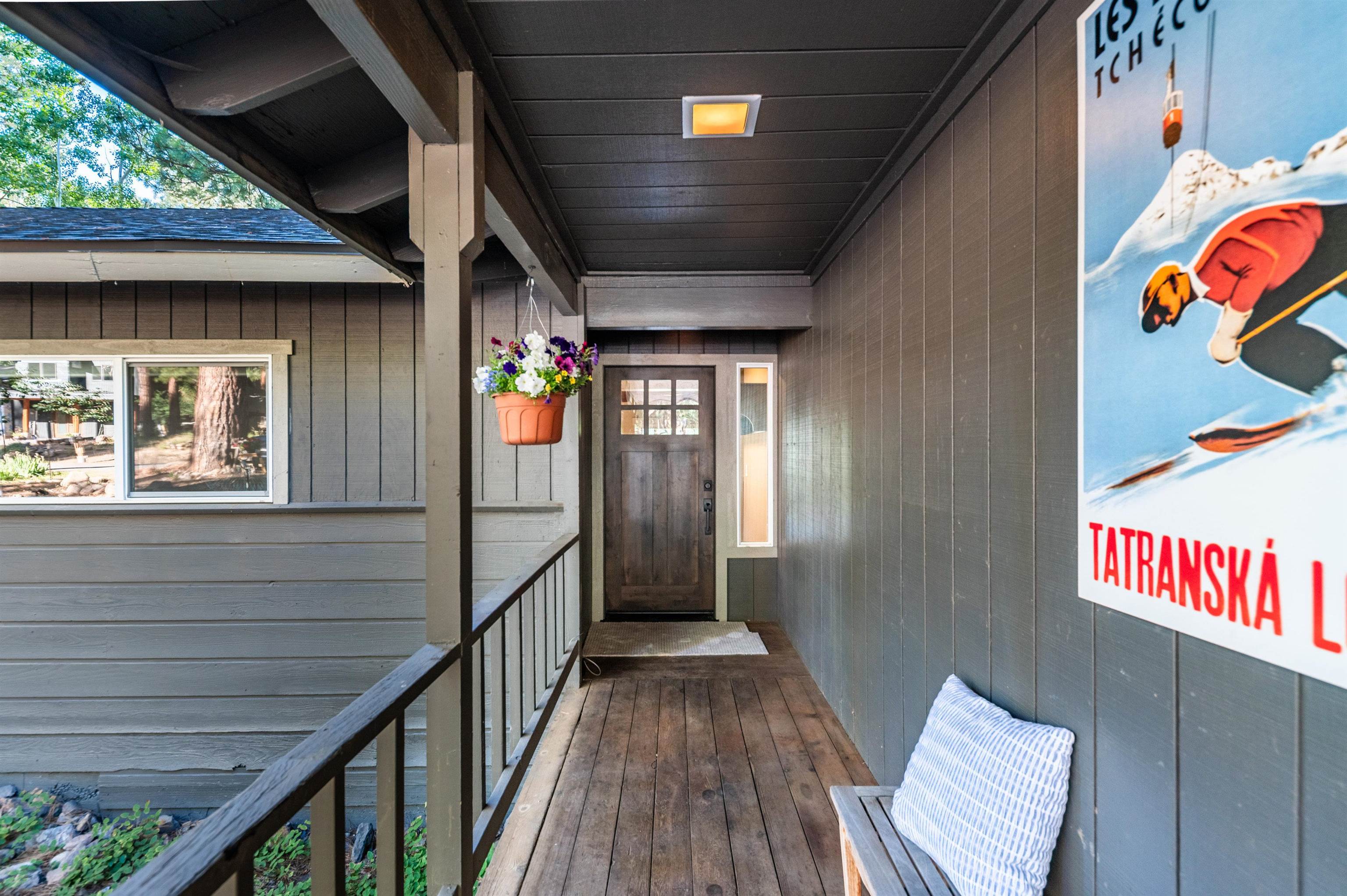 10644 Codogan Street Truckee, CA 96161 - Photo 3 of 28 a view of a hallway with wooden floors and furniture
