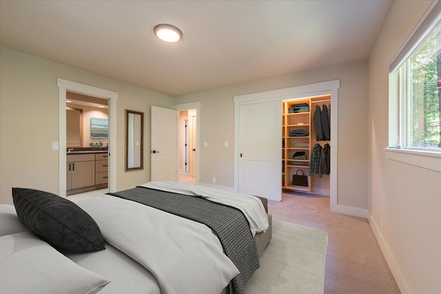 10644 Codogan Street Truckee, CA 96161 - Photo 8 of 28 a bedroom with a bed cabinets and a window