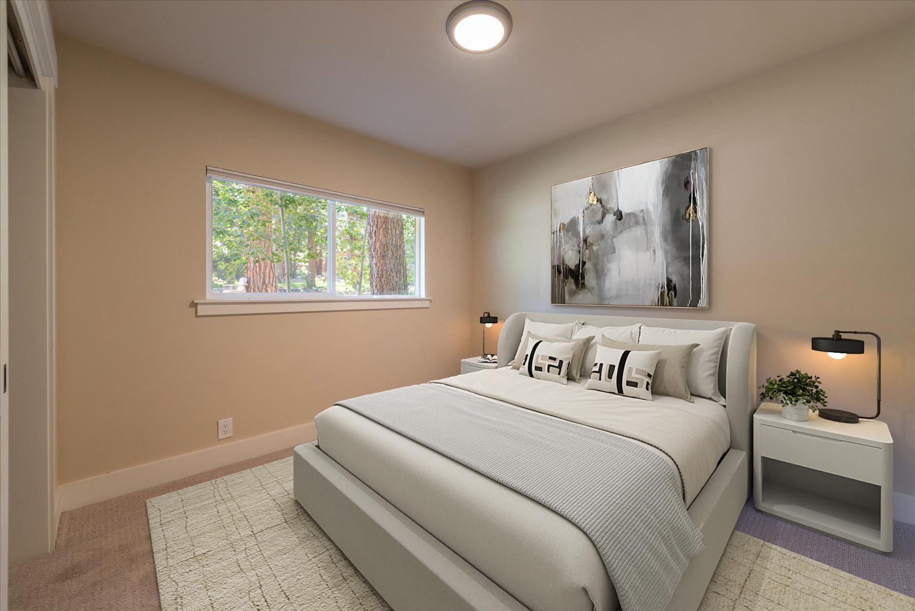 10644 Codogan Street Truckee, CA 96161 - Photo 10 of 28 a bedroom with a bed and a painting on the wall