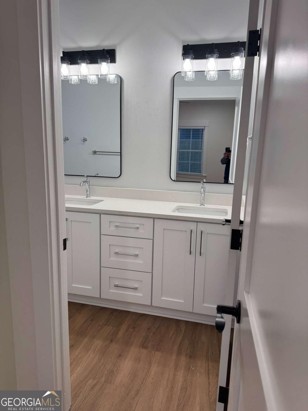 350 Rucker Lane, Unit AB Statesboro, GA 30458 - Photo 10 of 20 a bathroom with a double vanity sink and mirror
