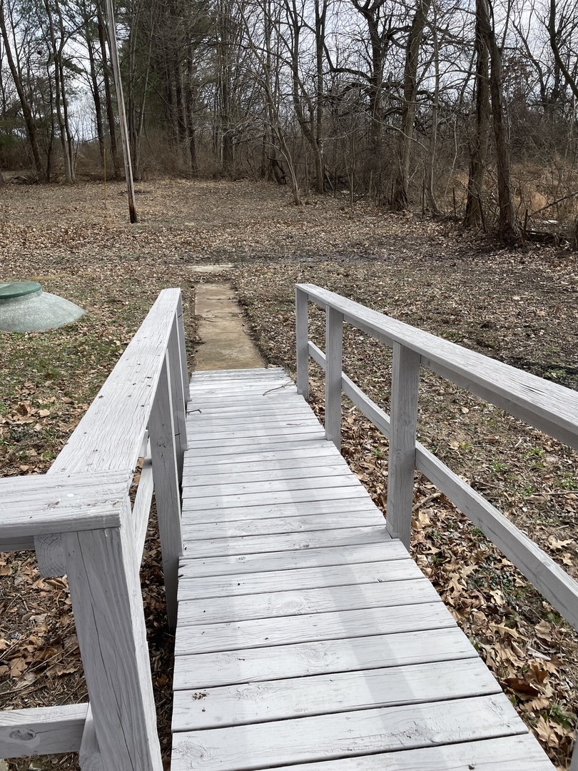 746 Mt Mission Road Metropolis, IL 62960 - Photo 22 of 24 a view of wooden deck and forest