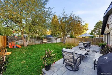 a view of a table and chairs in the garden