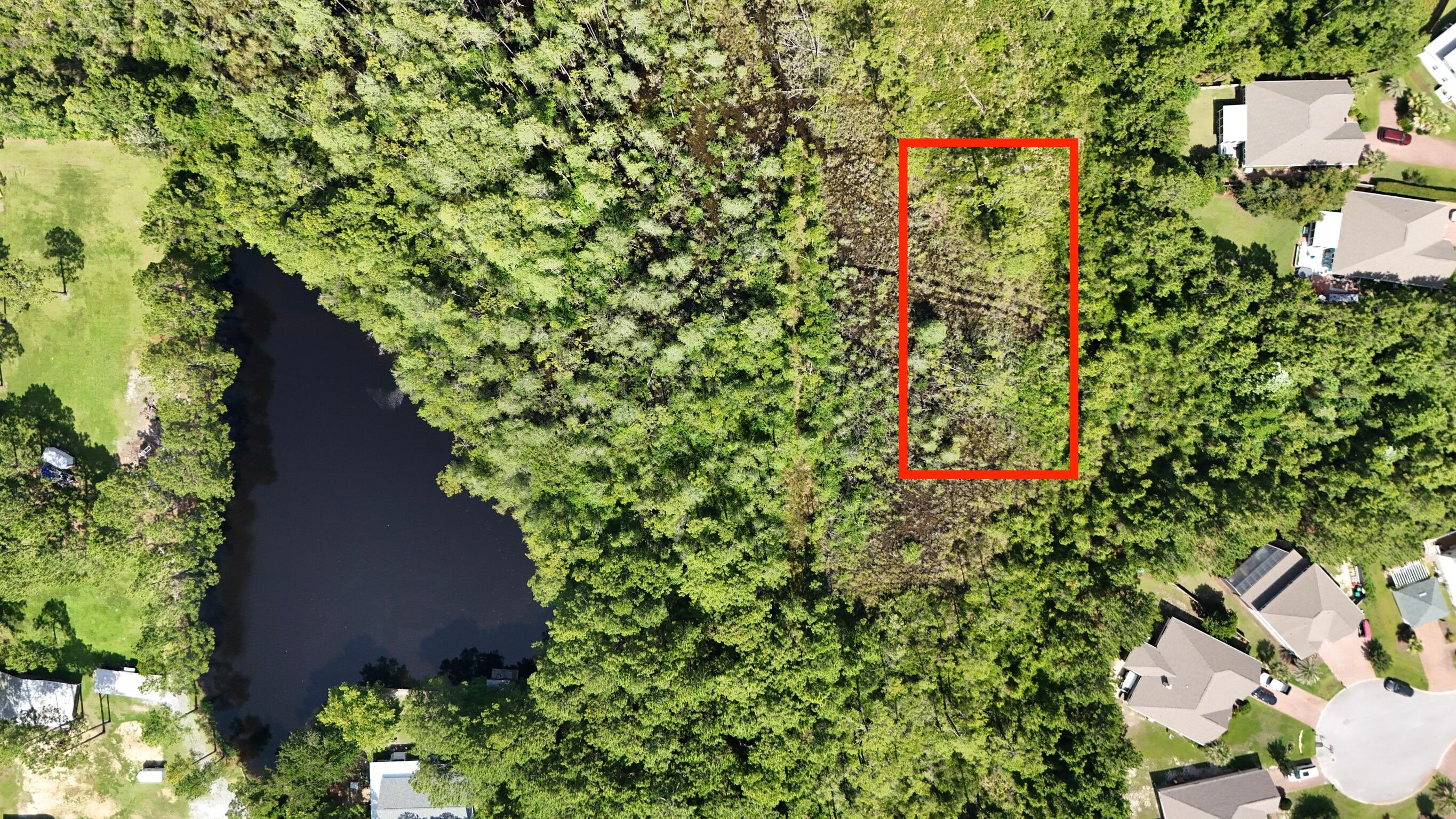 12-13 Calm Gulf Drive Santa Rosa Beach, FL 32459 - Photo 5 of 9 an aerial view of residential house with outdoor space and trees all around