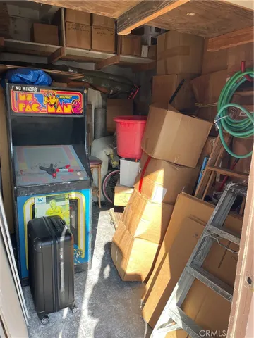 a view of storage and utility room with closet dryer and washer