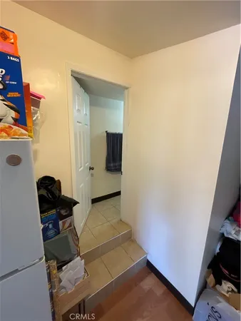 a bedroom with bed and a flat tv screen