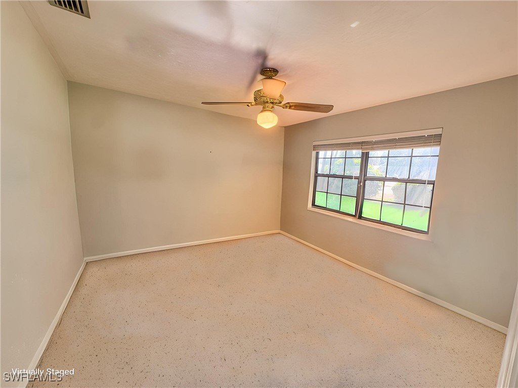 75 Hardee Street LaBelle, FL 33935 - Photo 19 of 24 an empty room with windows and fan