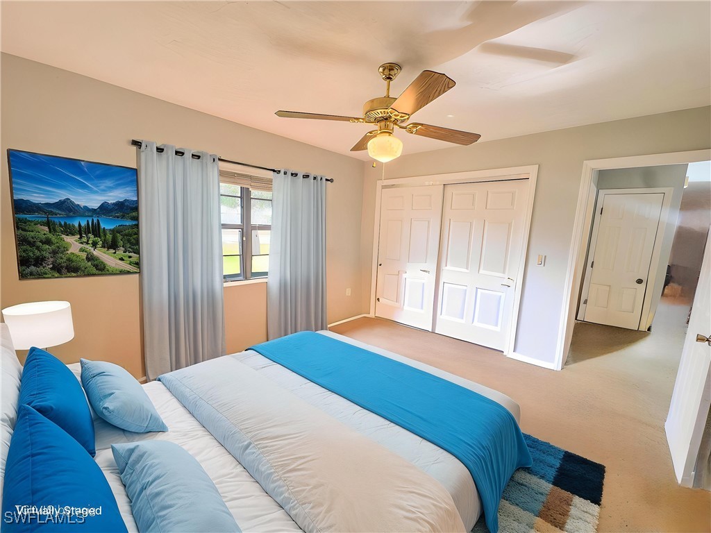 75 Hardee Street LaBelle, FL 33935 - Photo 20 of 24 a bedroom with a large bed and a window