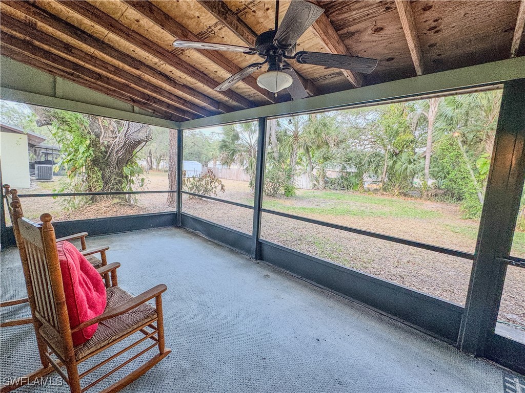 75 Hardee Street LaBelle, FL 33935 - Photo 23 of 24 a living room with furniture and a large window