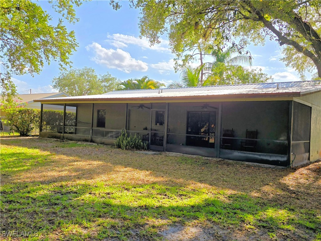 75 Hardee Street LaBelle, FL 33935 - Photo 4 of 24 a view of a house with a yard and sitting area