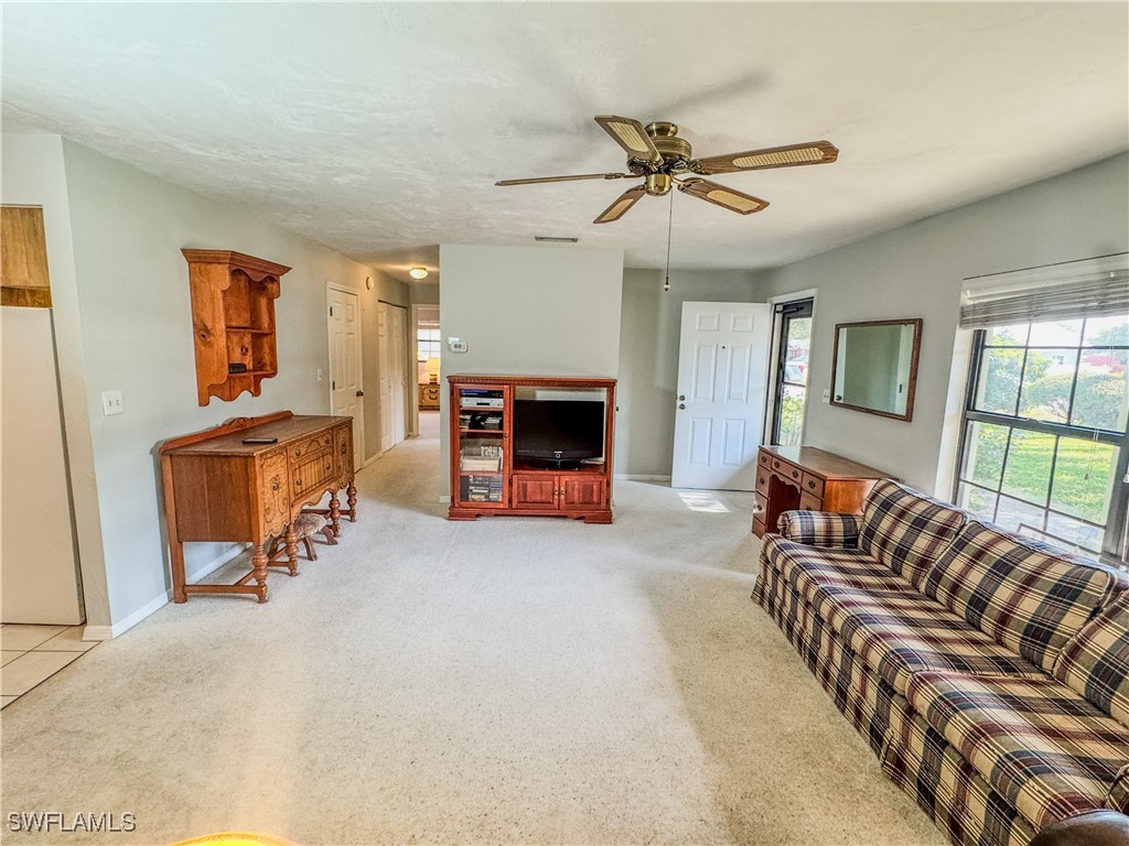 75 Hardee Street LaBelle, FL 33935 - Photo 7 of 24 a living room with furniture and a fireplace