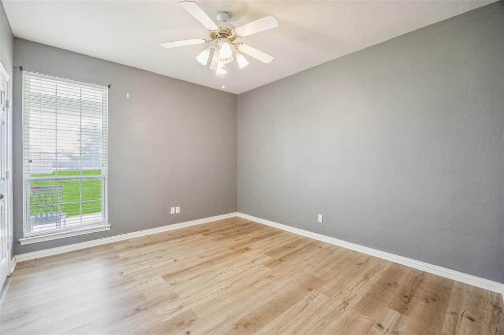 1107 Ruidoso Downs Drive Talty, TX 75160 - Photo 17 of 33 an empty room with windows and fan