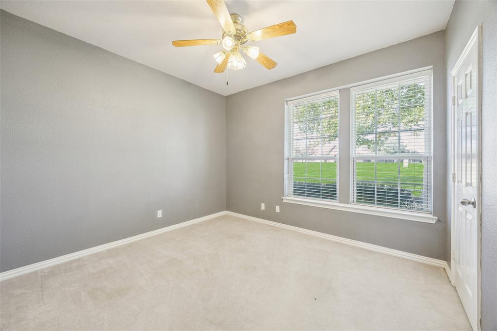 1107 Ruidoso Downs Drive Talty, TX 75160 - Photo 19 of 33 a view of an empty room with a window