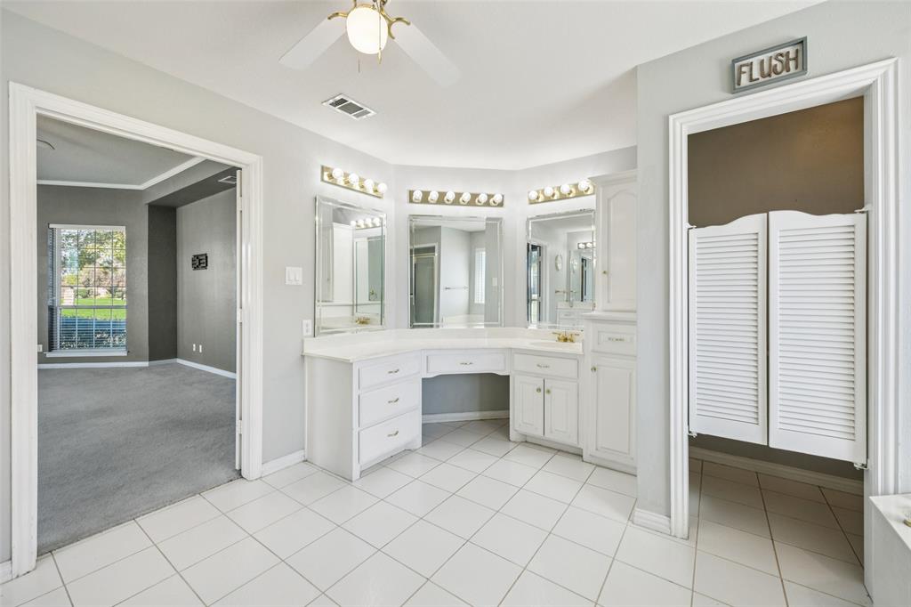 1107 Ruidoso Downs Drive Talty, TX 75160 - Photo 23 of 33 a spacious bathroom with a double vanity sink and a mirror