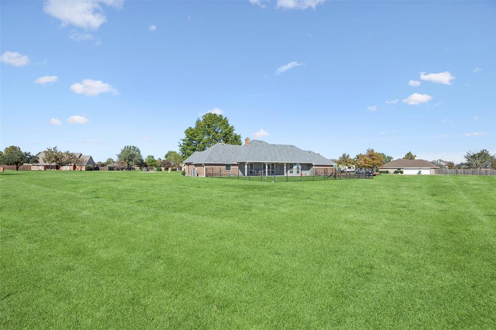 1107 Ruidoso Downs Drive Talty, TX 75160 - Photo 30 of 33 a view of a house with backyard and garden