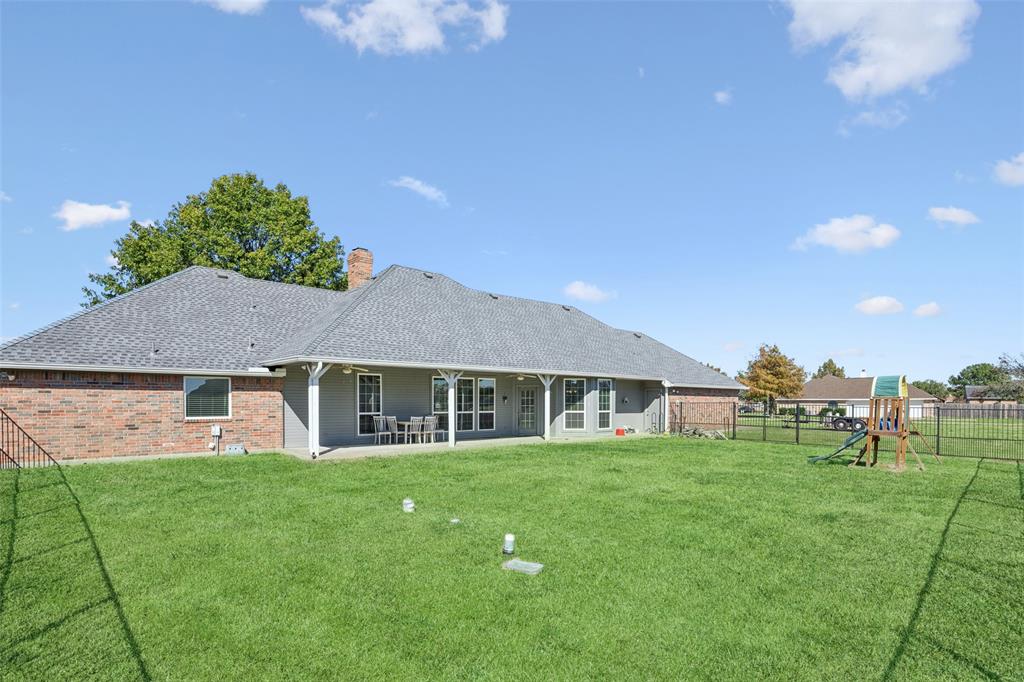 1107 Ruidoso Downs Drive Talty, TX 75160 - Photo 31 of 33 a house view with a garden space