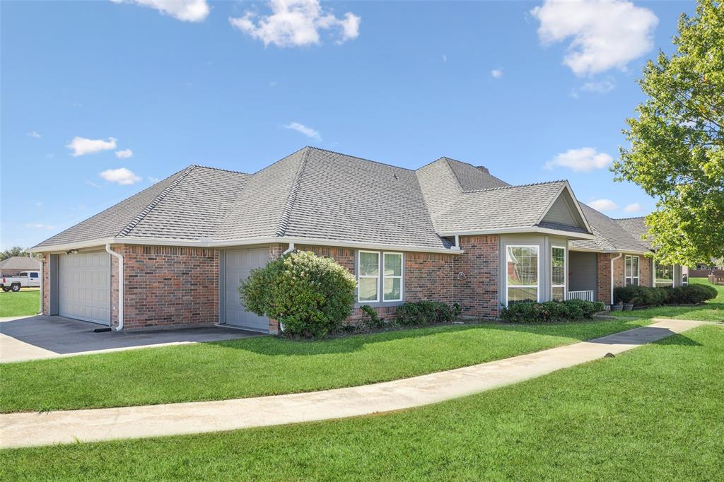 1107 Ruidoso Downs Drive Talty, TX 75160 - Photo 33 of 33 a front view of a house with a garden