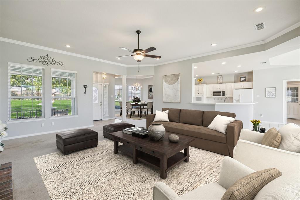 1107 Ruidoso Downs Drive Talty, TX 75160 - Photo 5 of 33 a living room with furniture ceiling fan and a window
