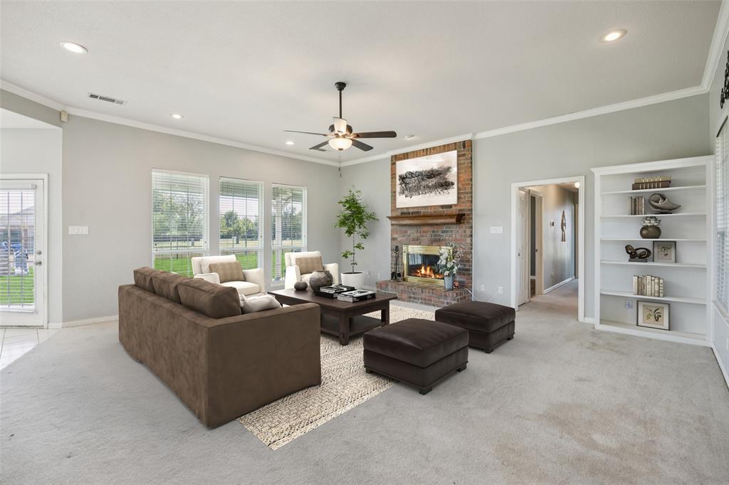 1107 Ruidoso Downs Drive Talty, TX 75160 - Photo 7 of 33 a living room with furniture and a large window