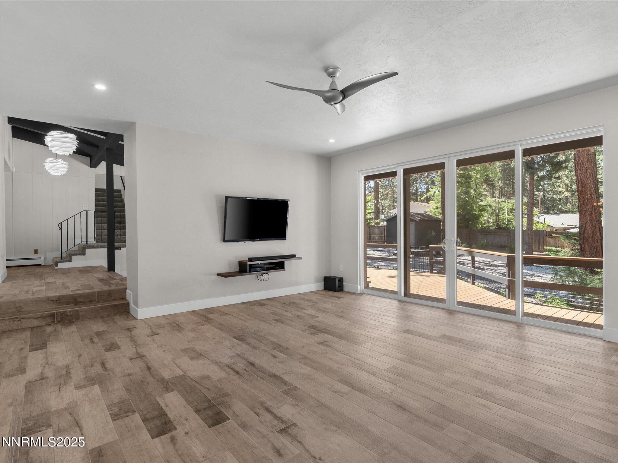 189 Ray Way Zephyr Cove, NV 89448 - Photo 12 of 71 a view of a livingroom with wooden floor and a flat screen tv