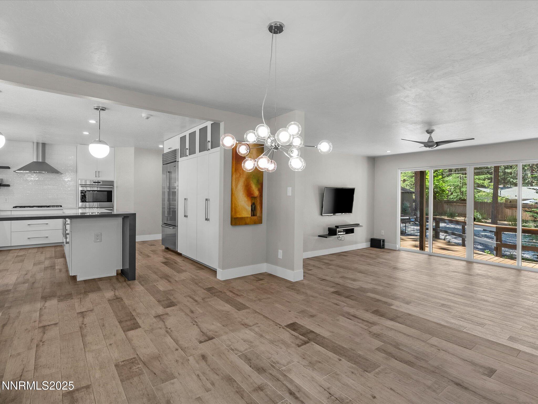 189 Ray Way Zephyr Cove, NV 89448 - Photo 15 of 71 a view of a kitchen with flat screen tv and refrigerator