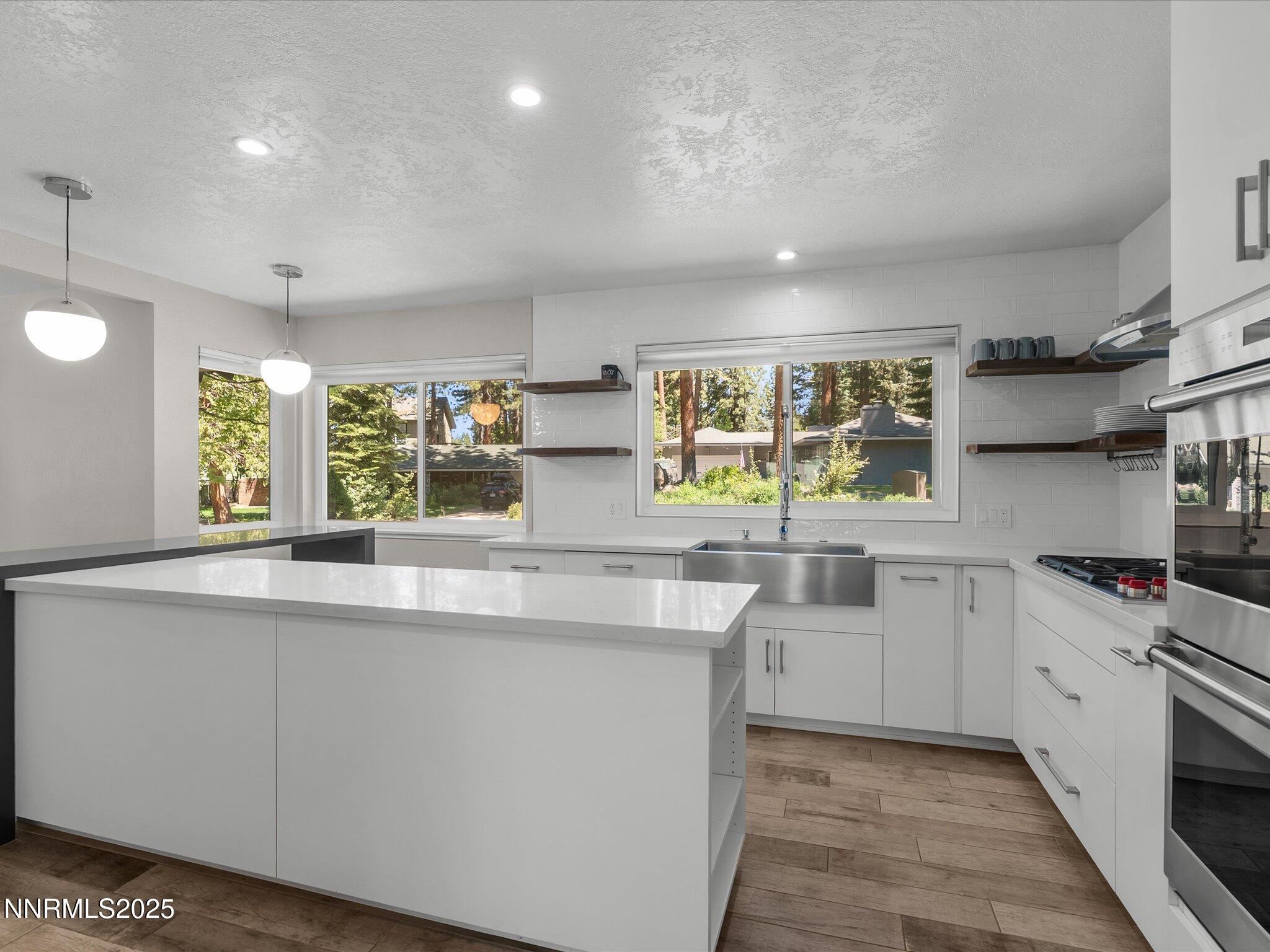 189 Ray Way Zephyr Cove, NV 89448 - Photo 16 of 71 a kitchen with stainless steel appliances a sink stove and cabinets