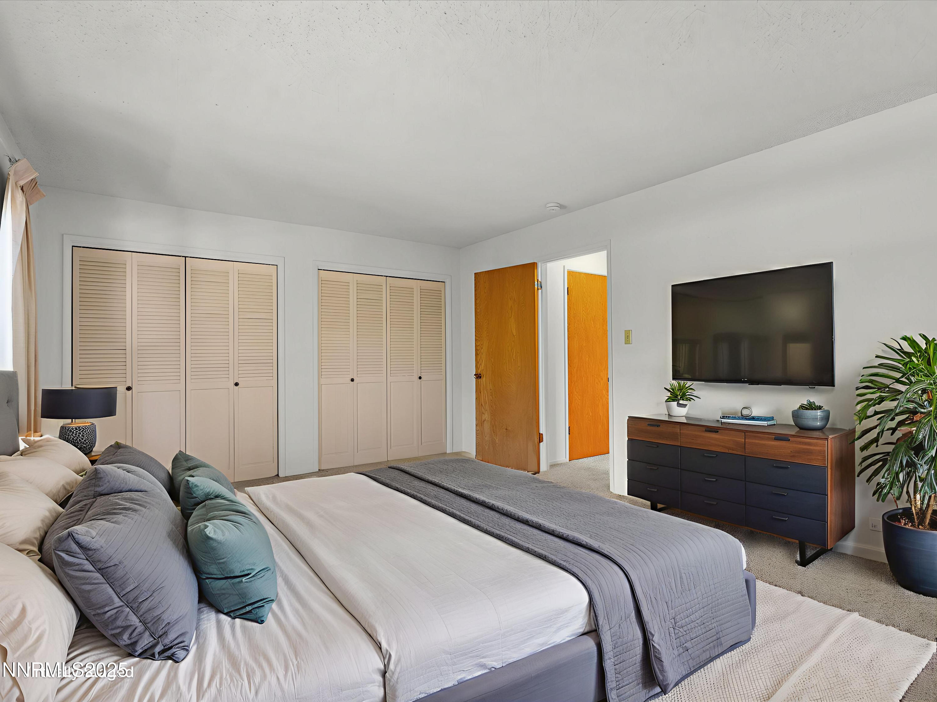 189 Ray Way Zephyr Cove, NV 89448 - Photo 29 of 71 a bedroom with a bed and a flat screen tv