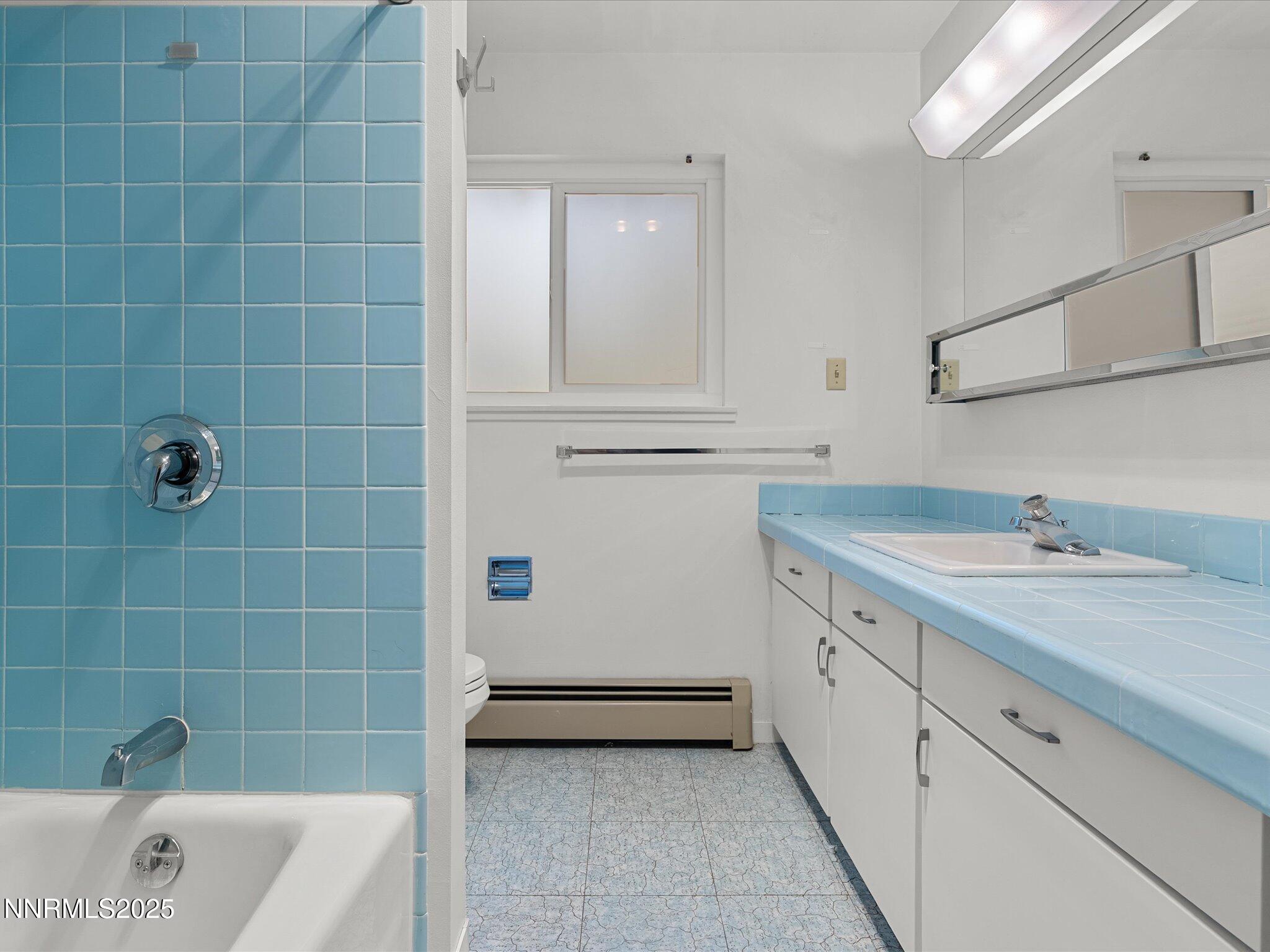 189 Ray Way Zephyr Cove, NV 89448 - Photo 37 of 71 a bathroom with a tub sink and mirror
