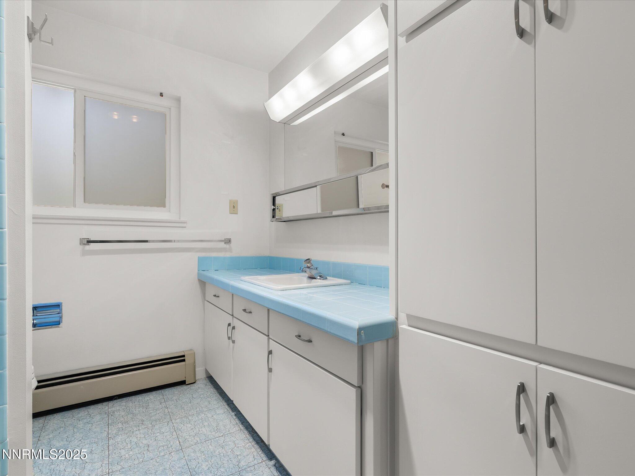 189 Ray Way Zephyr Cove, NV 89448 - Photo 39 of 71 a utility room with cabinets washer and dryer