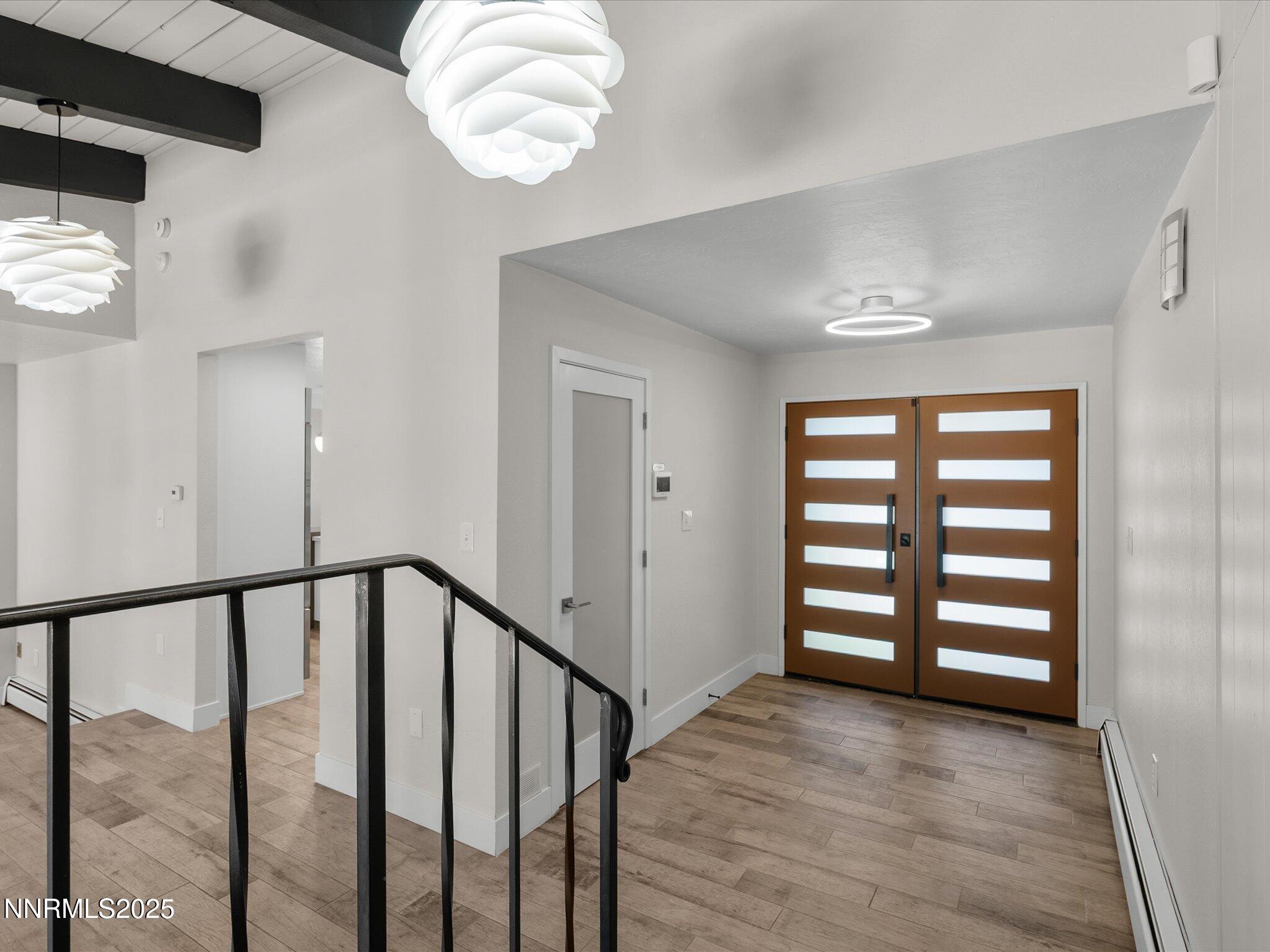 189 Ray Way Zephyr Cove, NV 89448 - Photo 5 of 71 a view of a hallway with wooden floor and staircase