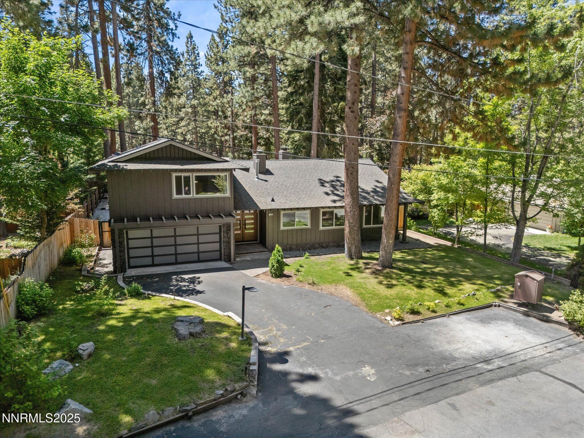189 Ray Way Zephyr Cove, NV 89448 - Photo 58 of 71 a front view of a house with a garden