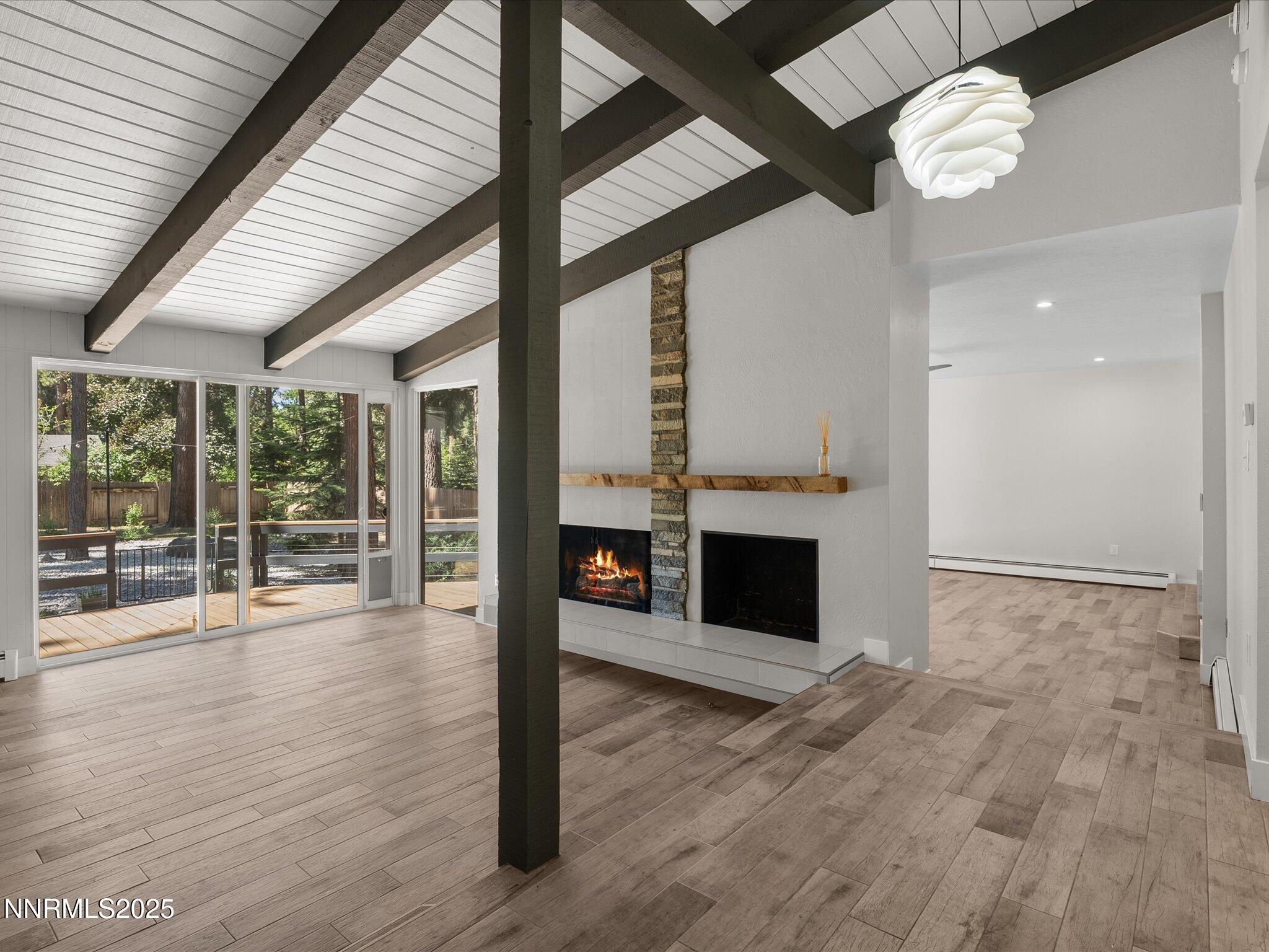 189 Ray Way Zephyr Cove, NV 89448 - Photo 6 of 71 a view of a livingroom with a ceiling fan window and wooden floor