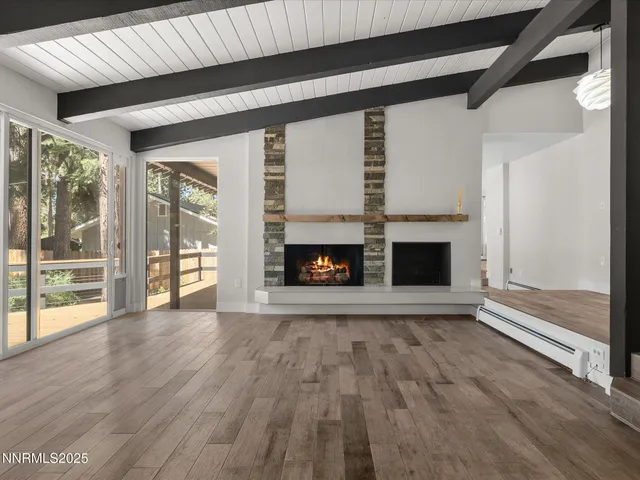 a kitchen with stainless steel appliances a sink a stove and a window