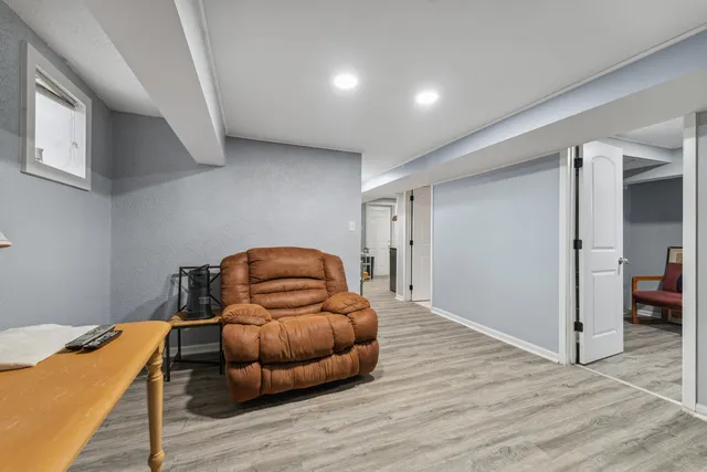 a bedroom with a bed and a couch