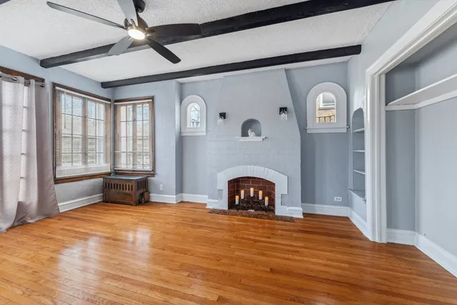 a bedroom with furniture and a fireplace