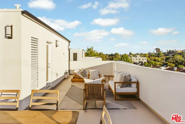 a view of a terrace with furniture and a terrace view