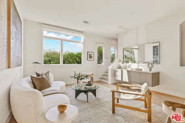 a living room with furniture and a table