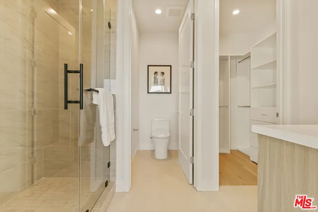 a bathroom with a granite countertop shower and a sink