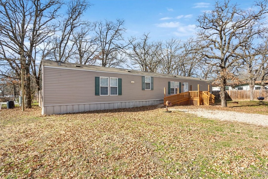 6067 Old Mexia Road Waco, TX 76705 - Photo 1 of 32 a house with trees in front of it