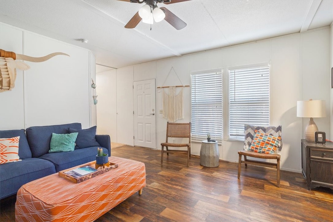 6067 Old Mexia Road Waco, TX 76705 - Photo 12 of 32 a living room with furniture and a wooden floor