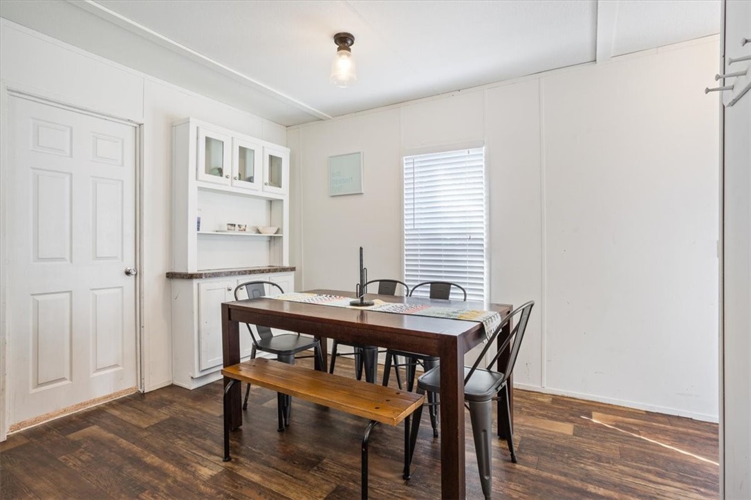 6067 Old Mexia Road Waco, TX 76705 - Photo 13 of 32 a view of a dining room with furniture and wooden floor