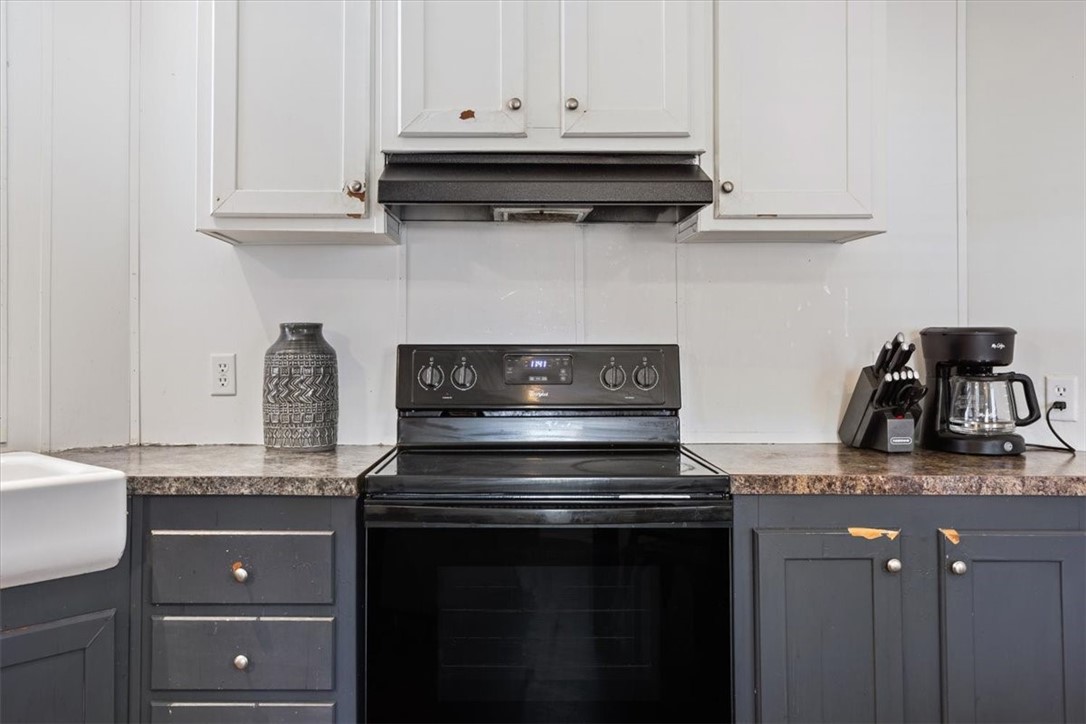 6067 Old Mexia Road Waco, TX 76705 - Photo 16 of 32 a stove top oven sitting inside of a kitchen