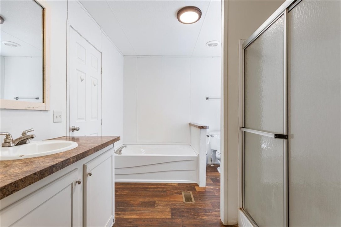 6067 Old Mexia Road Waco, TX 76705 - Photo 20 of 32 a bathroom with a sink and a mirror