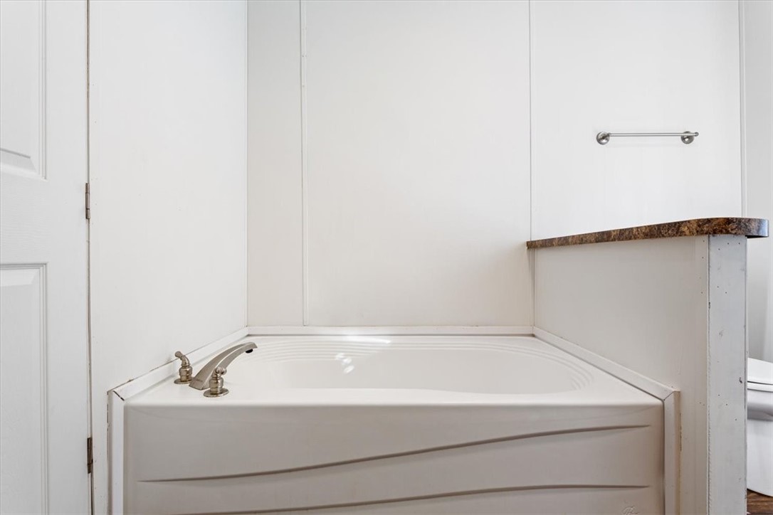 6067 Old Mexia Road Waco, TX 76705 - Photo 21 of 32 a bathroom with a sink and mirror