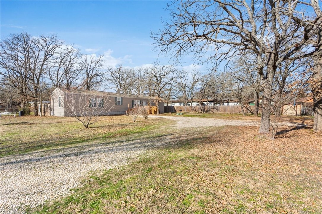 6067 Old Mexia Road Waco, TX 76705 - Photo 8 of 32 a view of road with large trees