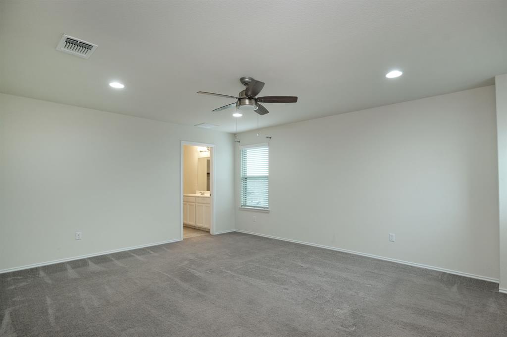 1409 Cliffbrake Way Georgetown, TX 78626 - Photo 4 of 10 Spacious room featuring neutral carpeting, a ceiling fan, recessed lighting, and a window with blinds