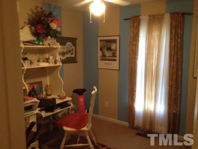 4300 Rockside Hills Drive Raleigh, NC 27603 - Photo 11 of 11 a room with a mirror and a window